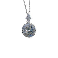 Silver necklace with a round, faceted pendant on a white background