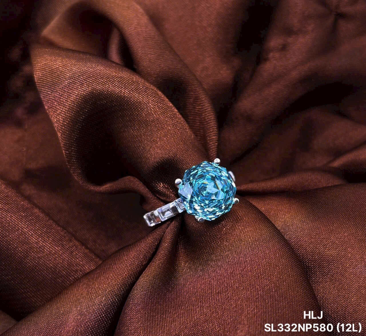 Blue gemstone ring on brown fabric