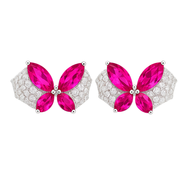 Butterfly-shaped earrings with pink gemstones and silver accents on a white background