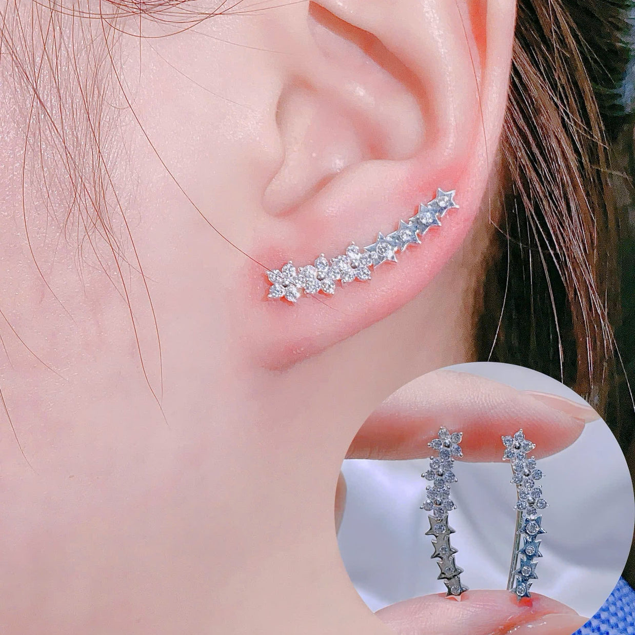 Close-up of an ear wearing a silver earring with a clear gemstone, inset showing the earring's design.