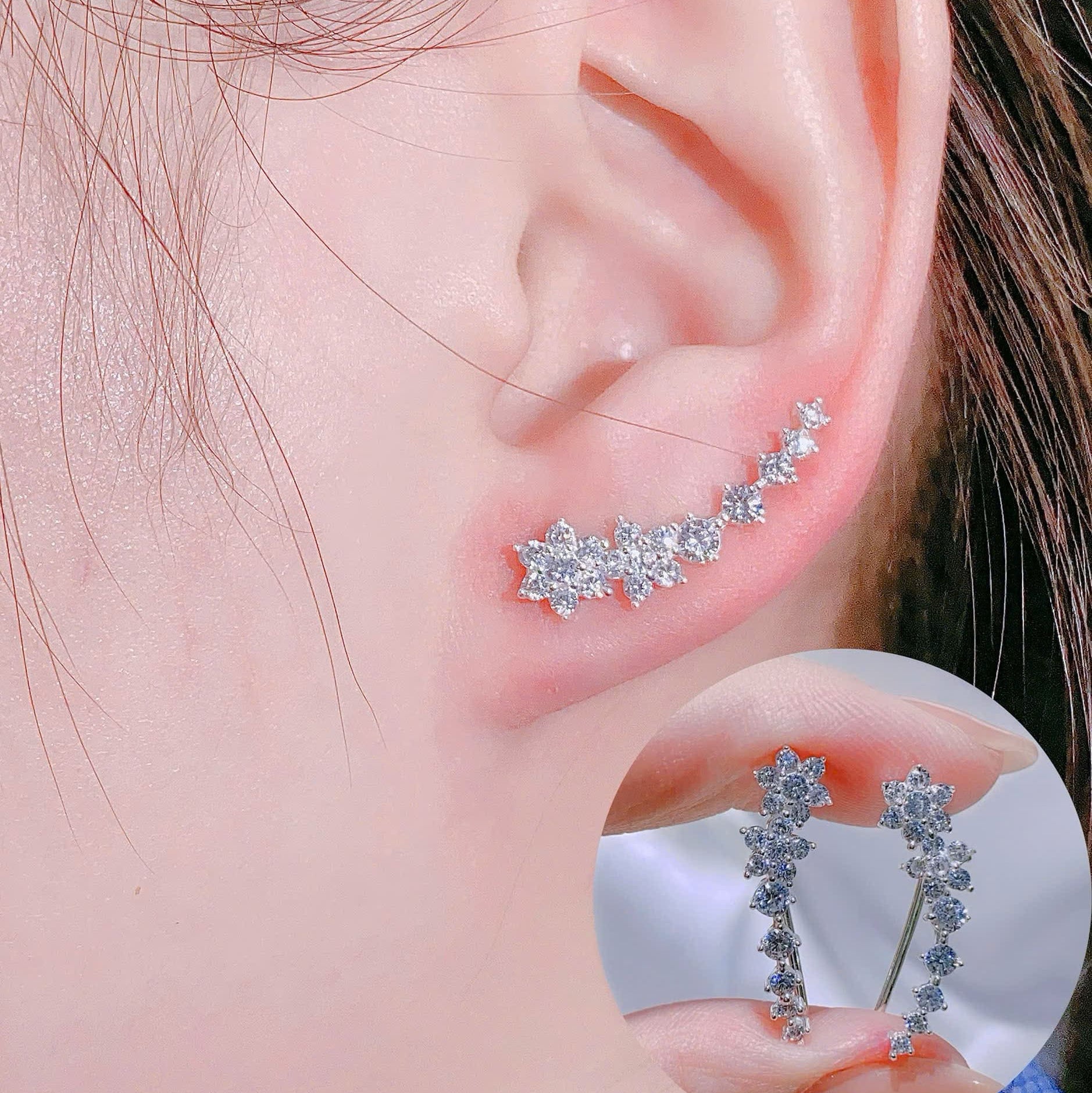 Close-up of an ear wearing a silver earring with a clear gemstone, inset showing the earring's design.