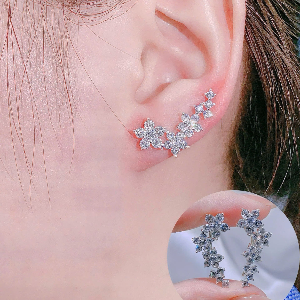 Close-up of an ear wearing a star-shaped earring with a clear background.