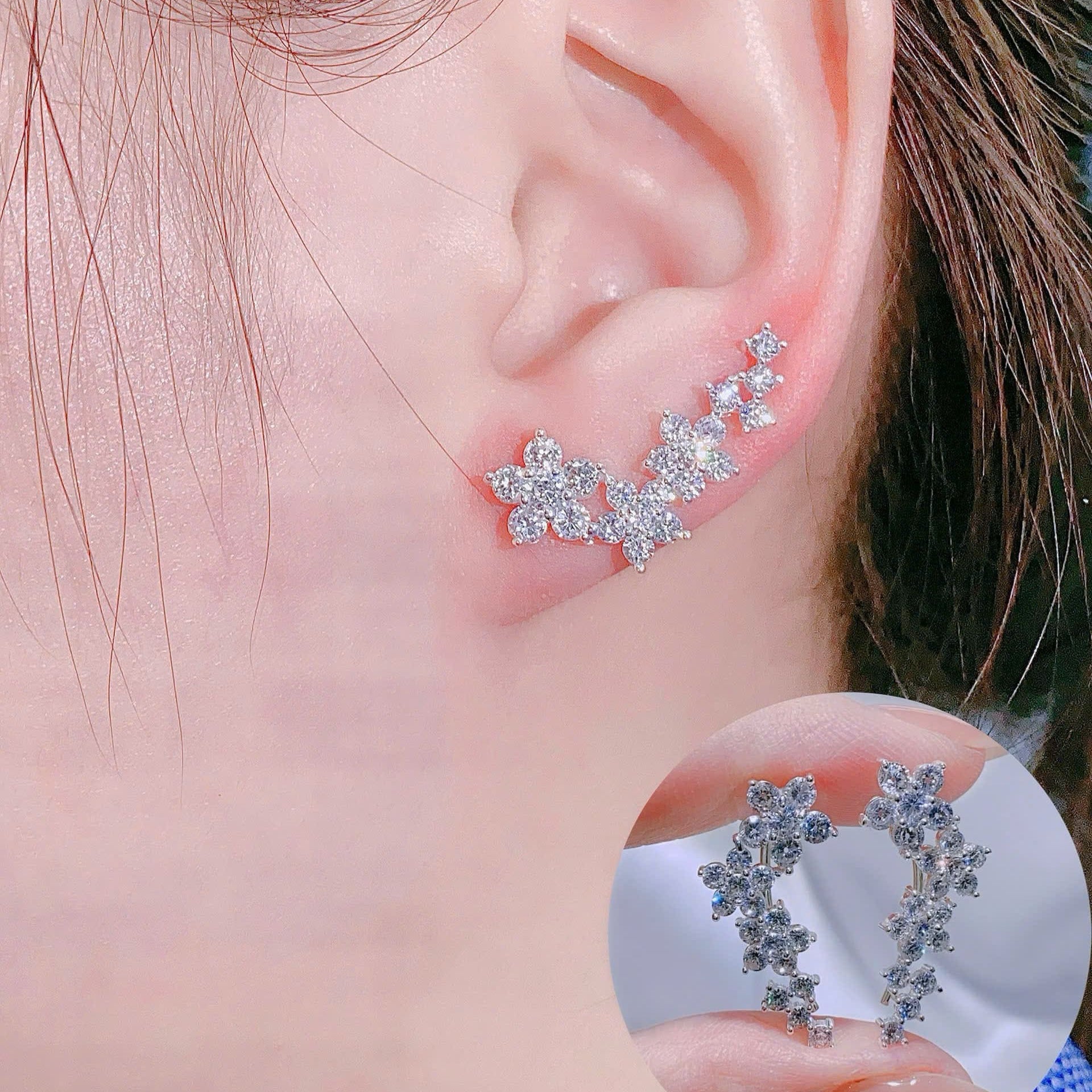 Close-up of an ear wearing a star-shaped earring with a clear background.