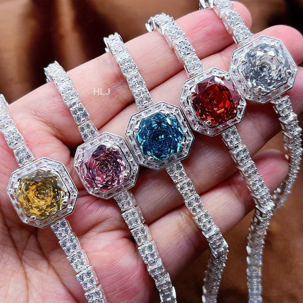 Colorful gemstone bracelets on a hand with a blurred background