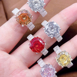 Colorful gemstone pendants on a hand