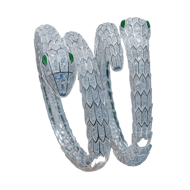 Diamond-encrusted snake ring on a green background