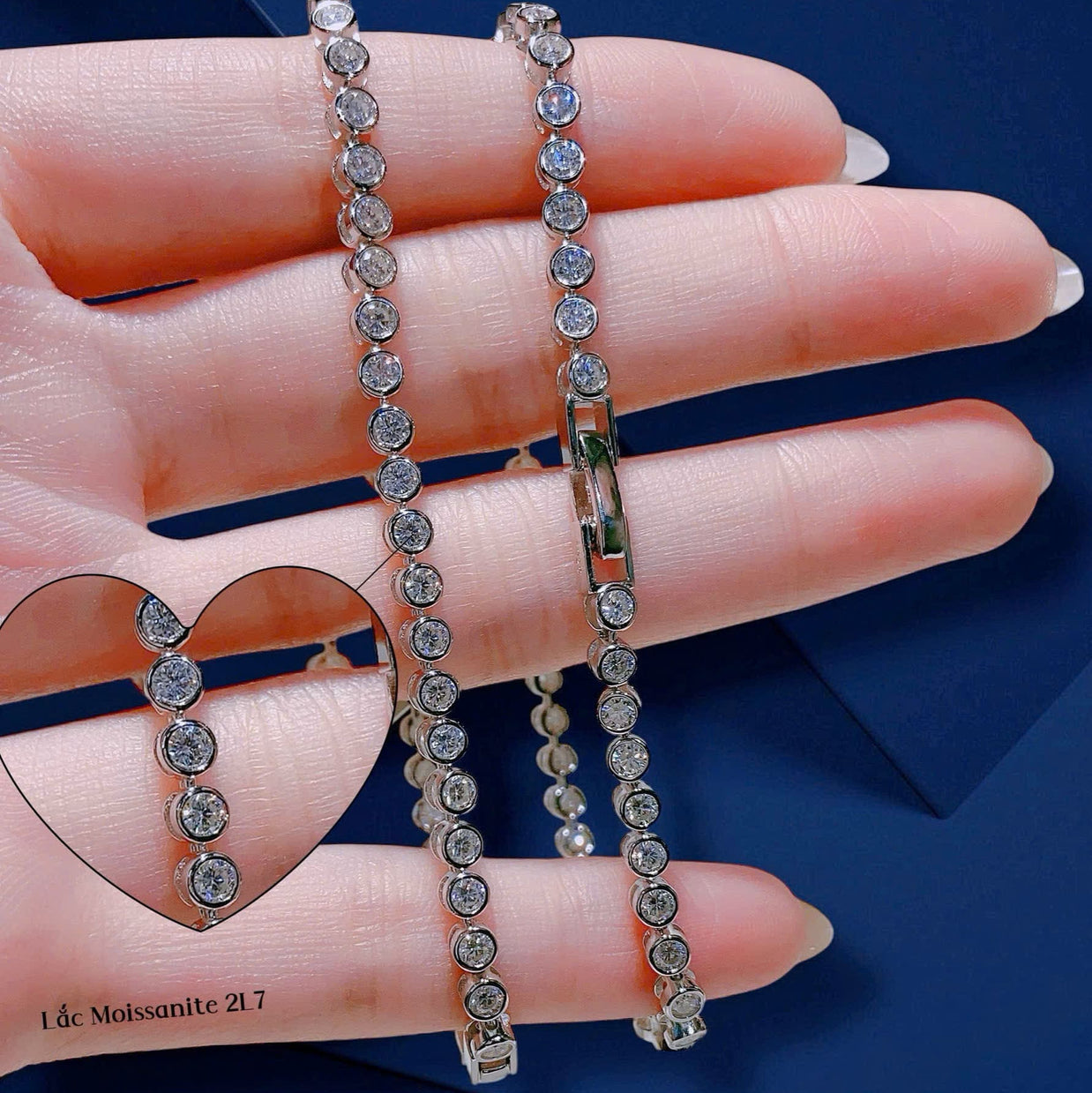 Diamond bracelet on a hand with a blue background
