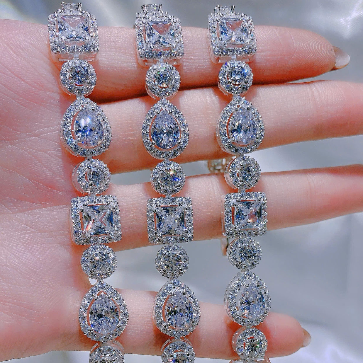 Diamond bracelet on a hand with a neutral background