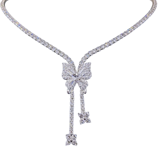 Diamond necklace with a bow-shaped pendant on a white background