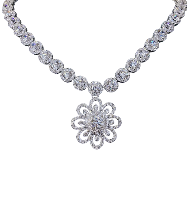 Diamond necklace with a floral pendant on a white background