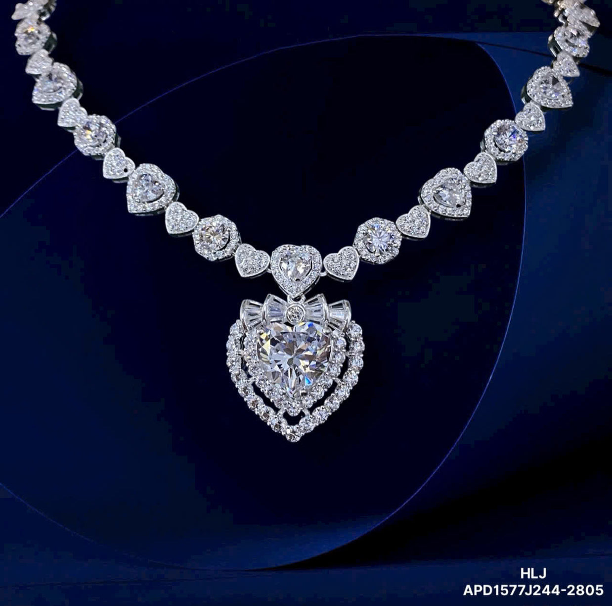 Diamond necklace with a heart-shaped pendant on a dark background