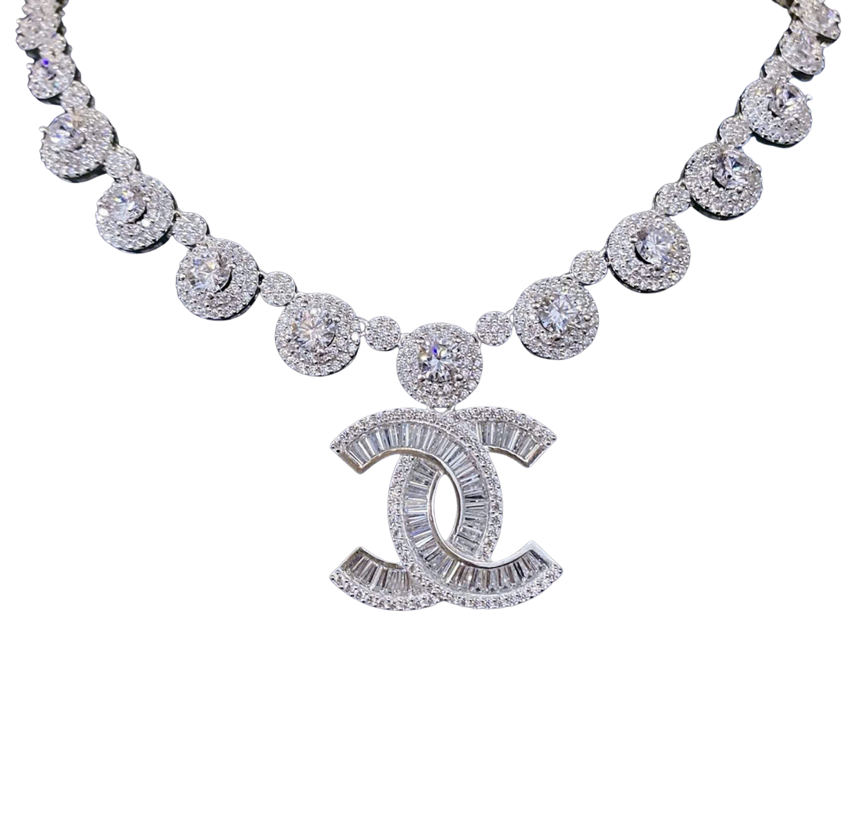 Diamond necklace with a prominent 'CC' logo on a white background