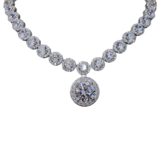 Diamond necklace with a round pendant on a white background
