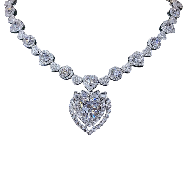 Diamond necklace with heart-shaped pendants on a white background