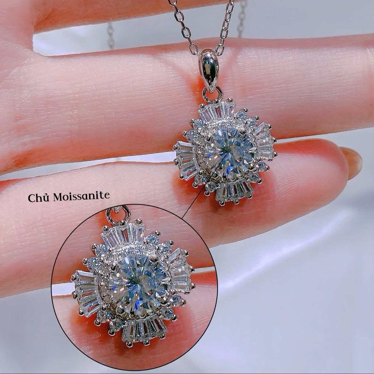 Diamond pendant on a hand with close-up inset, brand 'HLJ' visible