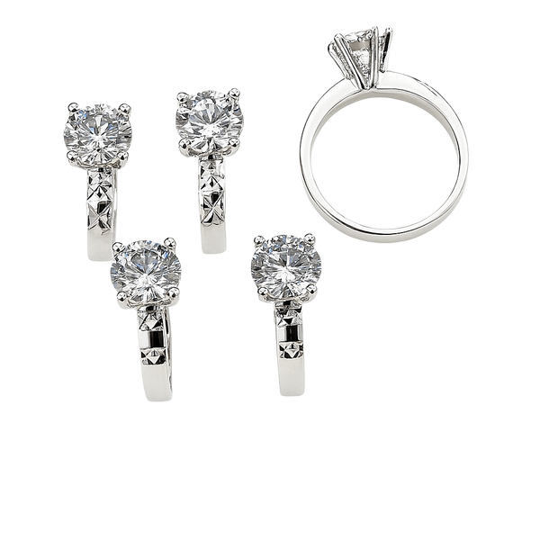 Diamond ring and earrings set on a white background