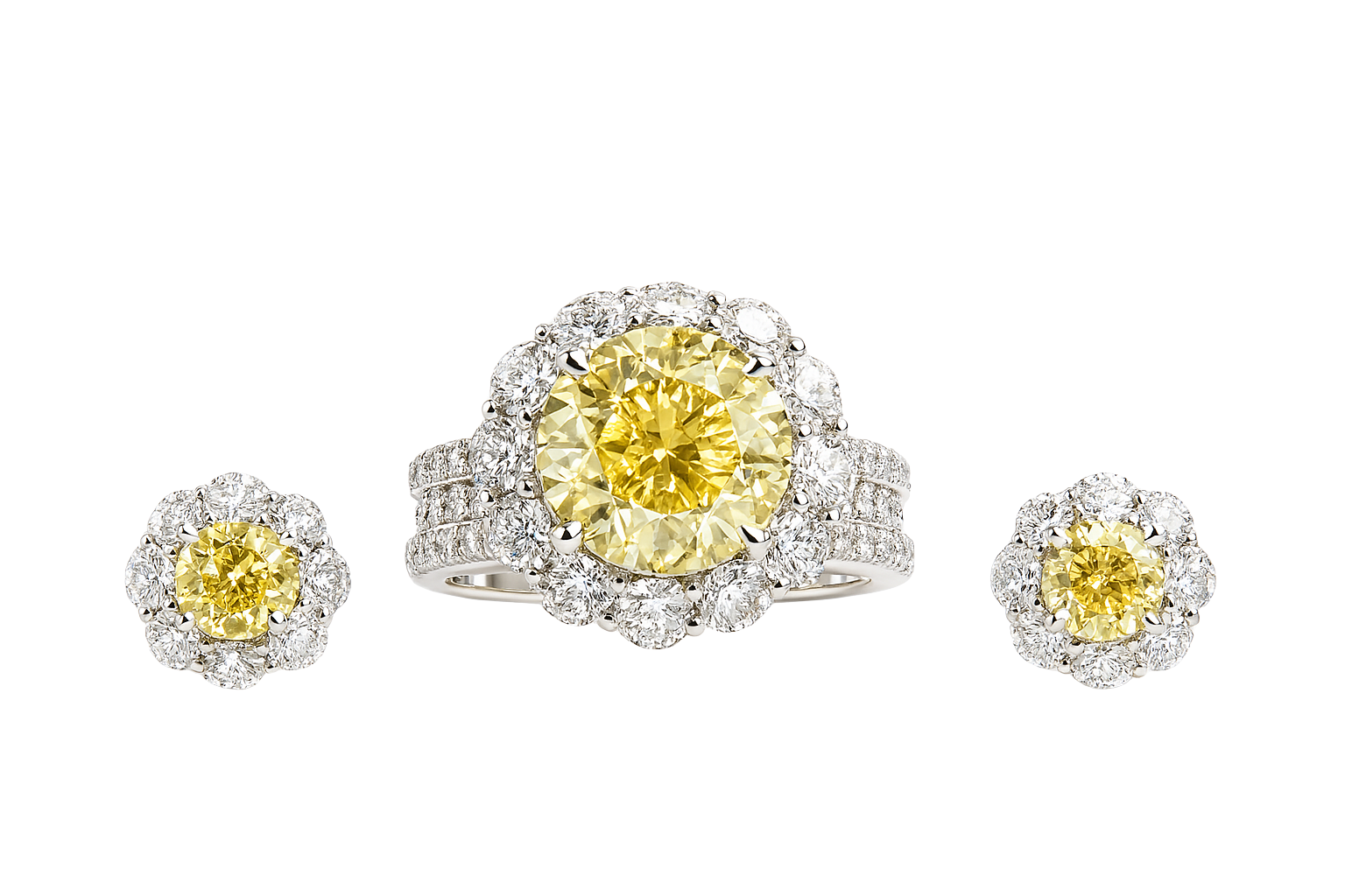 Diamond ring and earrings with yellow gemstones on a white background

