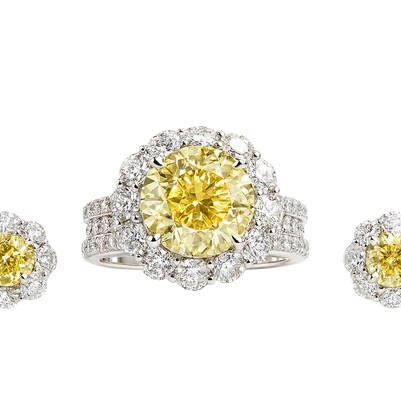 Diamond ring and earrings with yellow gemstones on a white background

