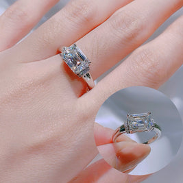 Diamond ring on a hand with a blurred background
