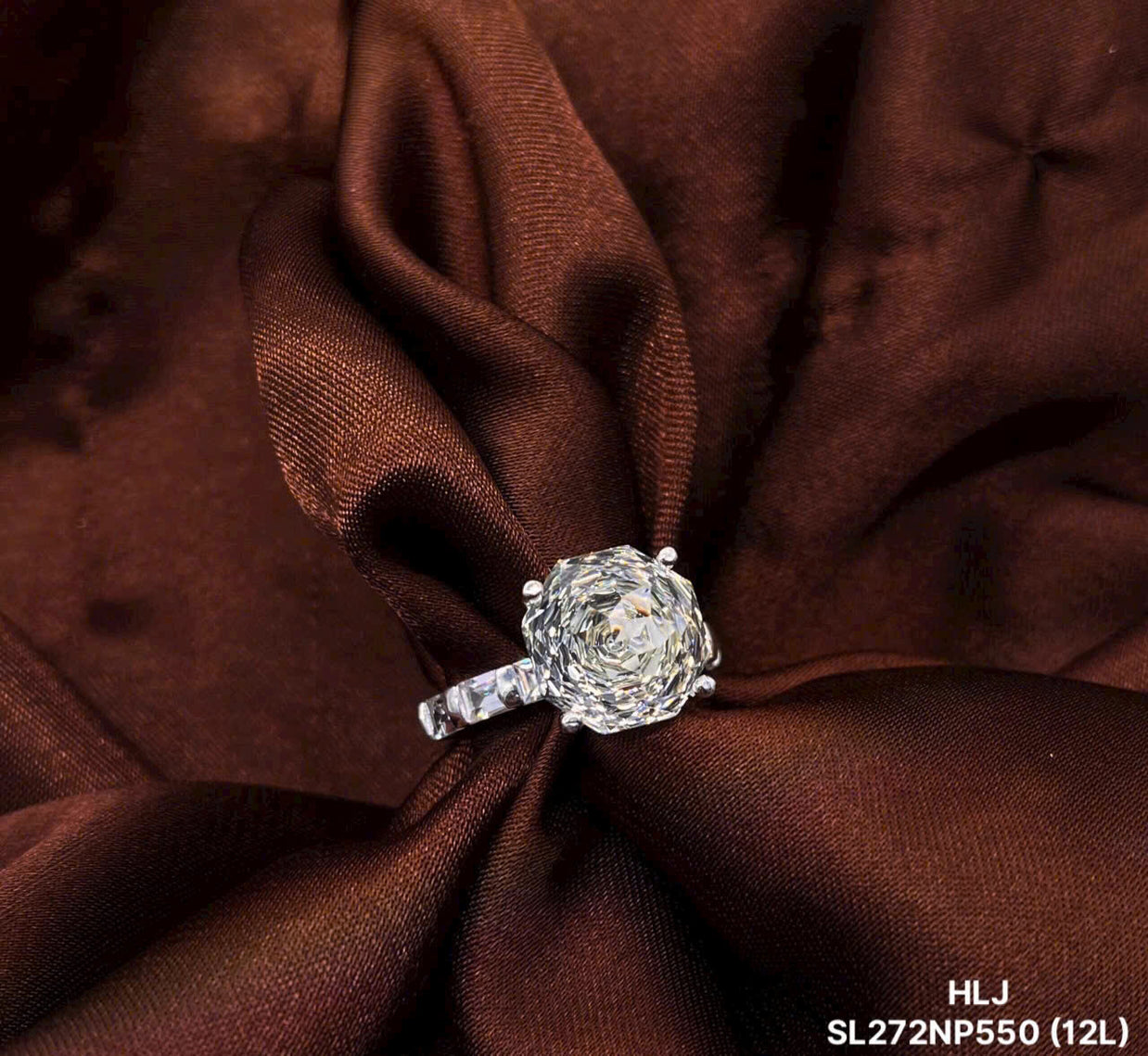 Diamond ring on a brown fabric background