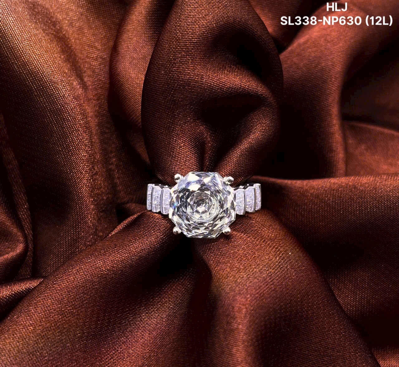 Diamond ring on a brown fabric background