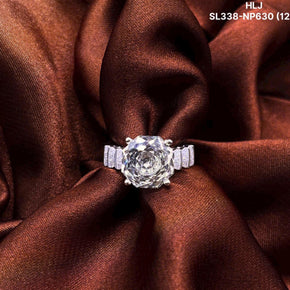 Diamond ring on a brown fabric background