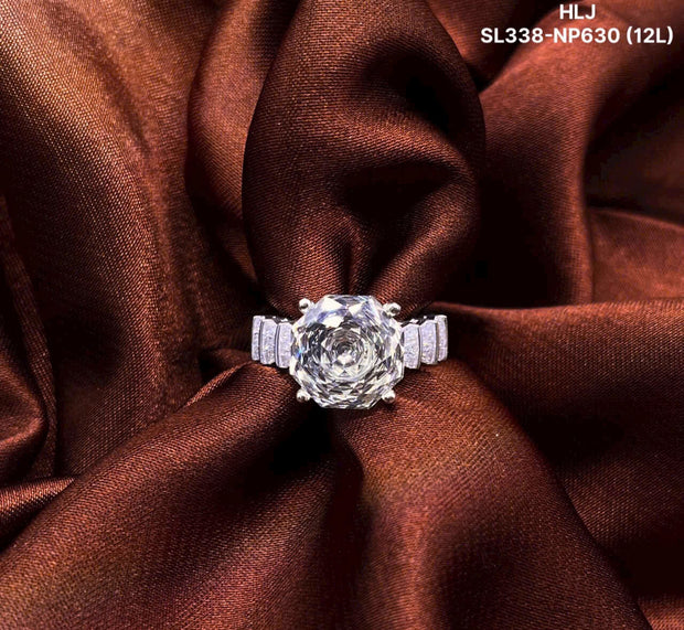 Diamond ring on a brown fabric background