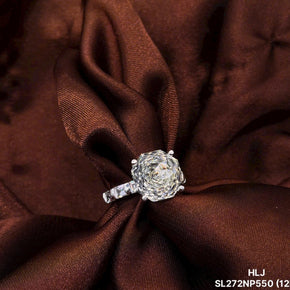 Diamond ring on a brown fabric background