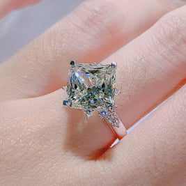 Diamond ring on a hand with a blurred background