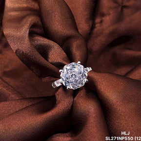 Diamond ring on brown fabric with 'HLJ' branding