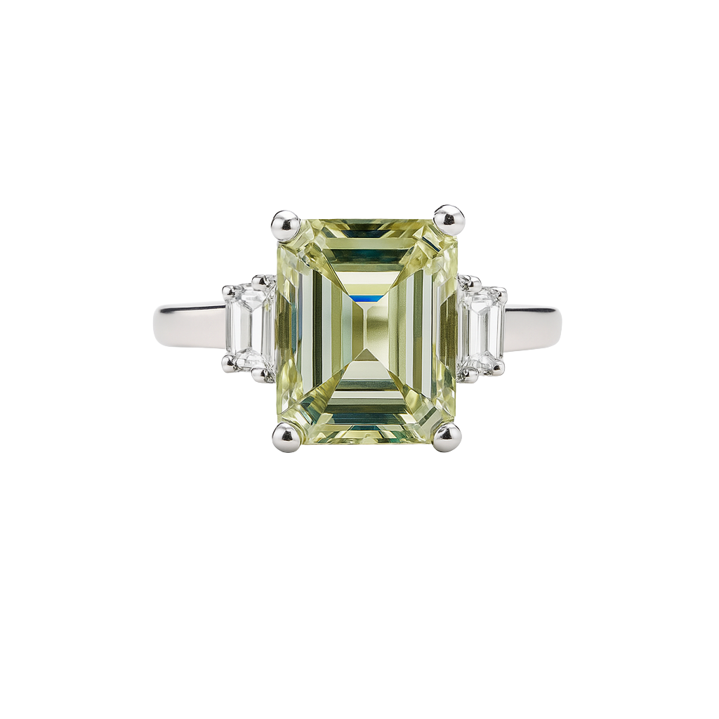 Diamond ring with a green gemstone on a white background