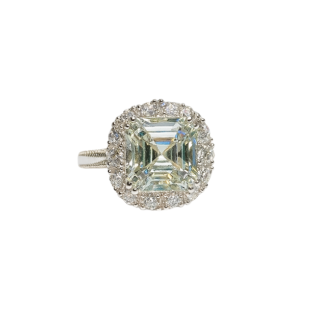 Diamond ring with a square-cut center stone on a white background