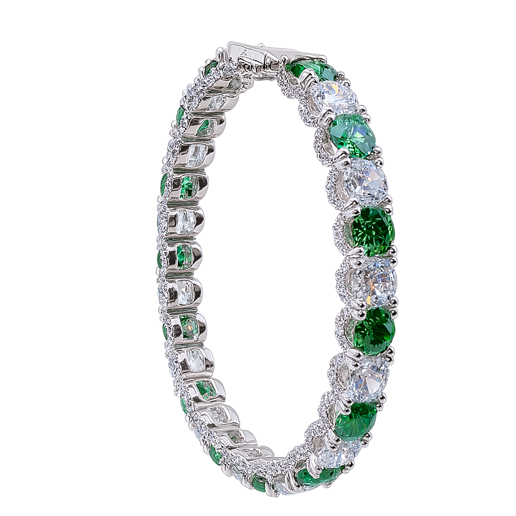 Elegant bracelet with green gemstones and clear stones on a white background