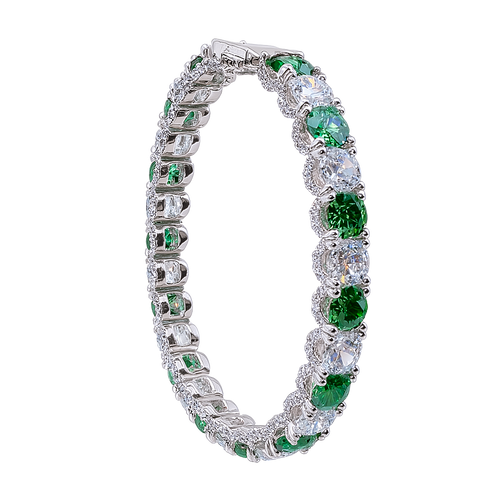 Elegant bracelet with green gemstones and clear stones on a white background