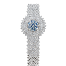 Elegant diamond bracelet with a central blue gemstone on a white background