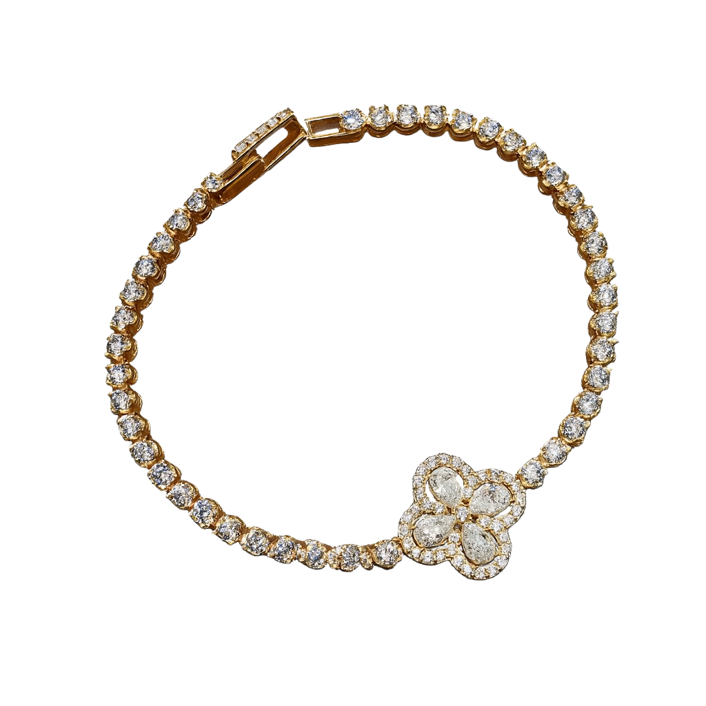 Gold bracelet with diamond accents on a white background