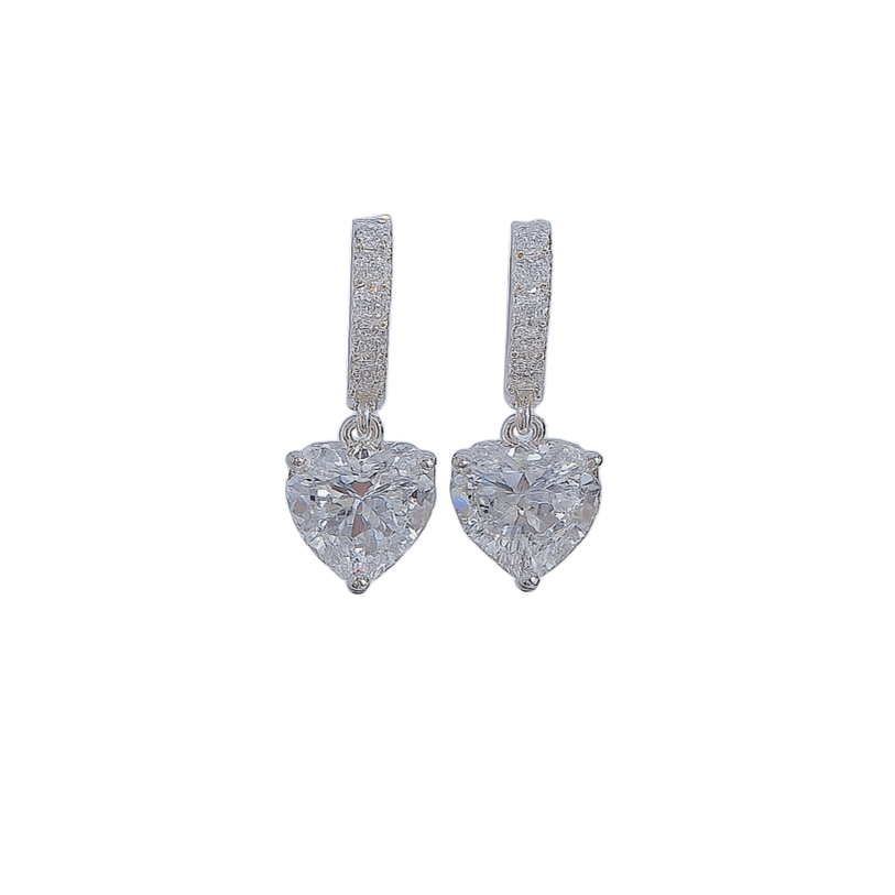 Heart-shaped diamond earrings on a white background