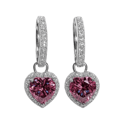Heart-shaped pink gemstone earrings with silver detailing on a white background