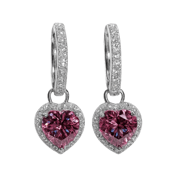 Heart-shaped pink gemstone earrings with silver detailing on a white background
