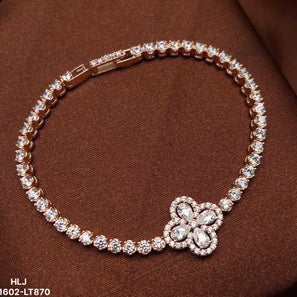 Jewelry bracelet with floral clasp on a brown background