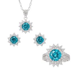 Jewelry set with blue gemstones on a white background