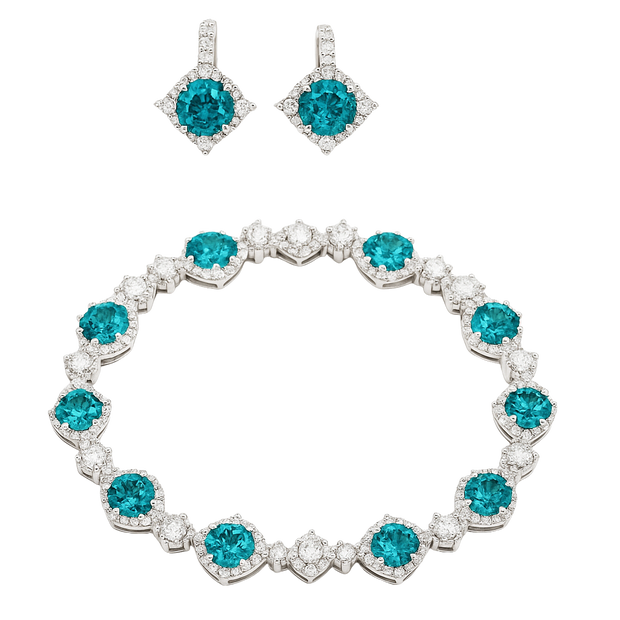 Jewelry set with bracelet and earrings featuring blue gemstones on a white background