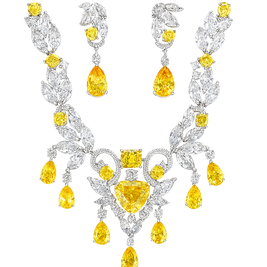 Luxury diamond necklace with yellow gemstones on a white background
