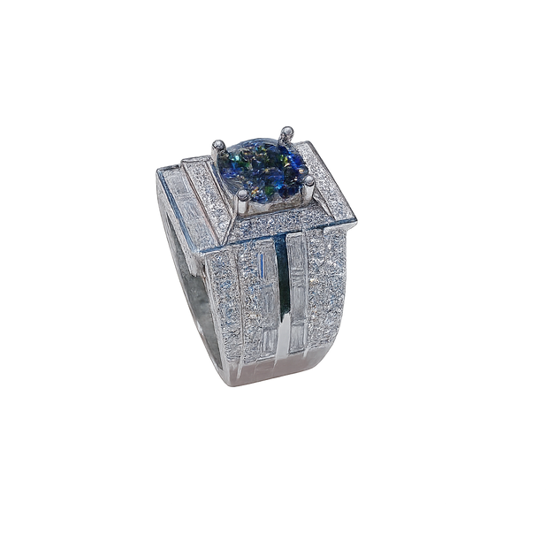 Luxury ring with a central gemstone and diamond-studded band on a white background