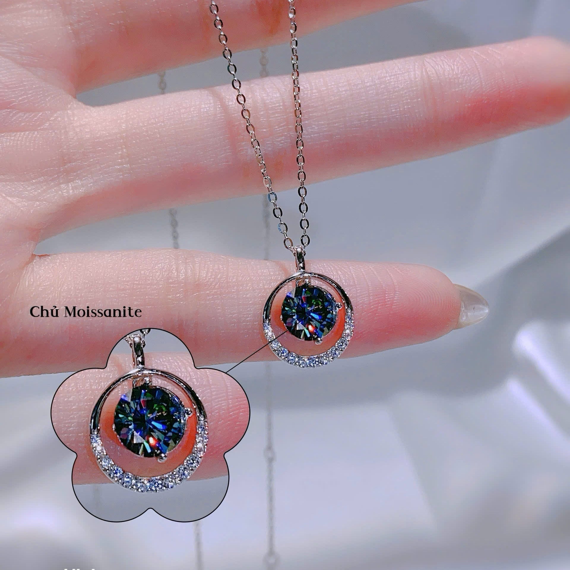 Necklace with a pendant on a hand, close-up view.