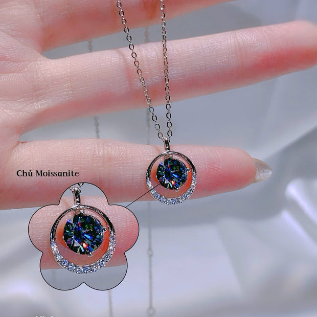 Necklace with a pendant on a hand, close-up view.