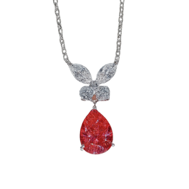 Necklace with a red teardrop pendant and silver chain on a white background