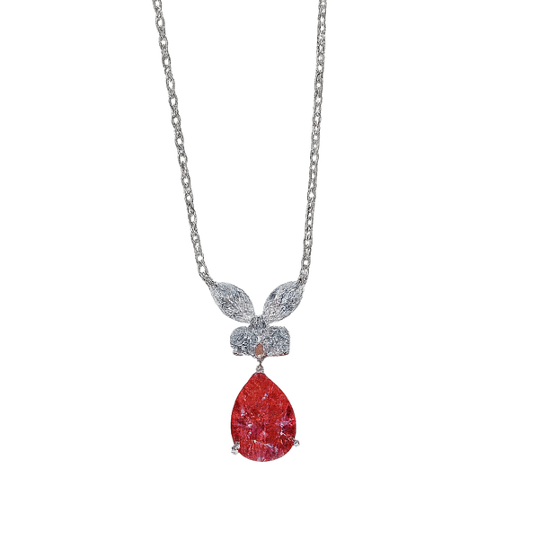 Necklace with a red teardrop pendant and silver chain on a white background