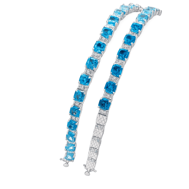 Pair of blue gemstone earrings on a transparent background