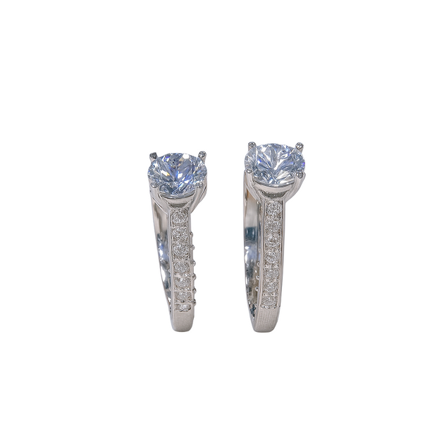 Pair of diamond earrings on a white background